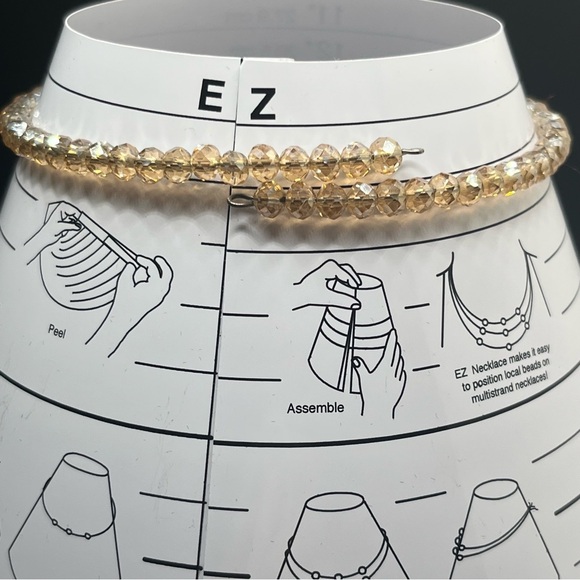 Modern light amber colored crystal choker with a teardrop rhinestone pendant. - Picture 5 of 9